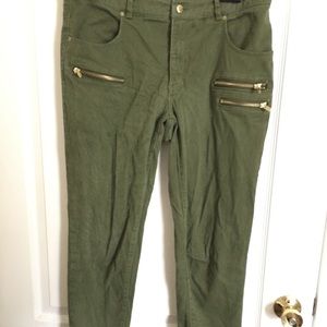 Green cargo pants with gold zippers